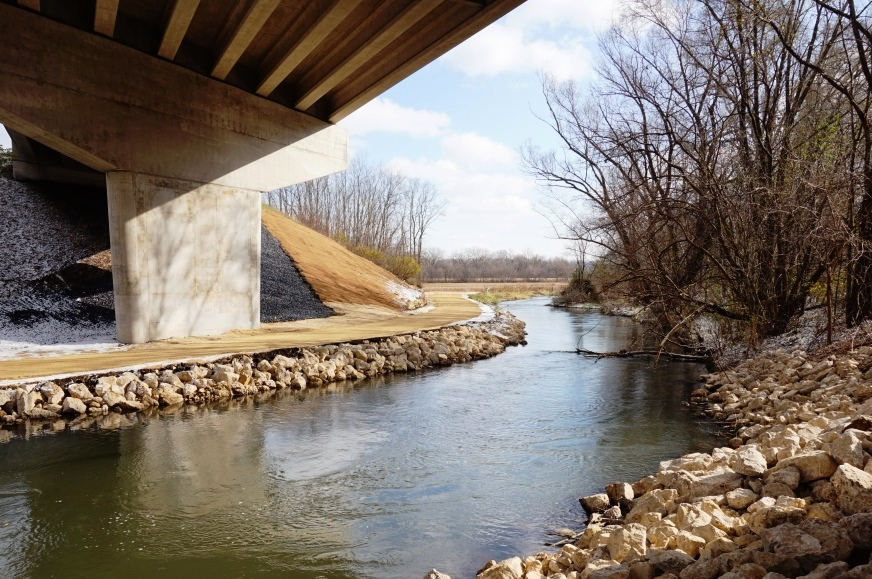 Stream repair on the bridge viaduct piers and restored the sloped embankment under the USH 14 underpass after the August 2018 flood.